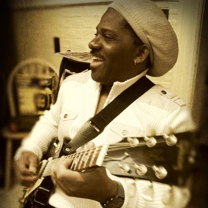 Ted Cohen playing guitar